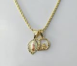 Gold plated tri-color Virgin Mary pendants on a braided chain necklace.
