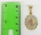 Delicate gold-plated pendant featuring Virgin Mary in ornate frame.
Ornate gold-plated pendant depicting Virgin Mary in