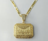 A gold-plated figaro chain necklace in 18K style with a large pendant.

A large 18K figaro chain necklace made of gold p