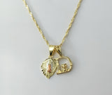 Gold plated 14K twist chain necklace with Virgin Mary pendants and letter D charm.

Gold plated Virgin Mary double penda