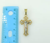 A gold-plated cross pendant with intricate rope details.
A gold-plated tri-colored cross pendant with rope accent.
A gol
