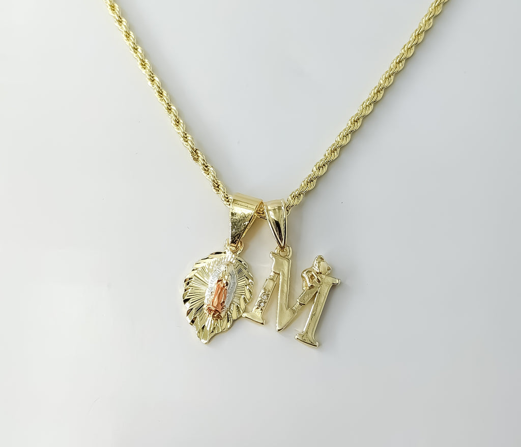 Gold plated tri-color Virgin Mary pendants on a braided chain necklace.
Tri-color Virgin Mary pendants on a 2mm braided