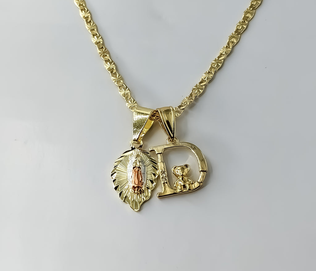 Delicate gold plated tri-color Virgin Mary pendants on a star chain necklace.