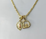 Delicate gold plated tri-color Virgin Mary pendants on a star chain necklace.