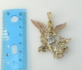 A gold-plated Archangel Saint Michael pendant in a circular shape.
A gold-plated figure of Archangel Saint Michael penda