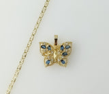 A delicate gold plated butterfly pendant on a dainty star chain necklace.