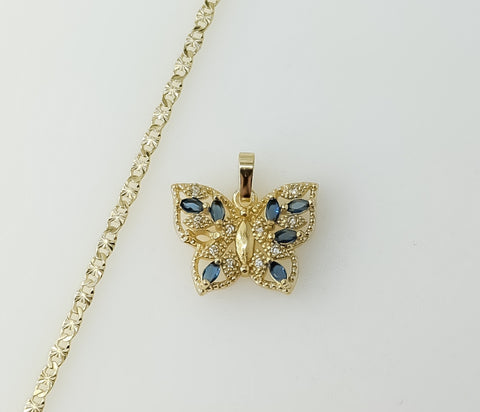 A delicate gold plated butterfly pendant on a dainty star chain necklace.