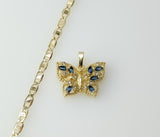 A dainty gold plated flat mariner anchor chain necklace with a butterfly pendant.