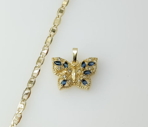 A dainty gold plated flat mariner anchor chain necklace with a butterfly pendant.