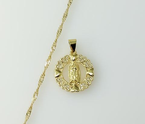 Gold plated Virgin Mary pendant on a 14K gold plated twist chain necklace.
Virgin Mary pendant hangs from a 14K gold pla
