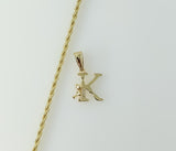 A delicate gold plated rope and braided chain necklace with a small letter pendant. 
A gold plated braided rope chain ne
