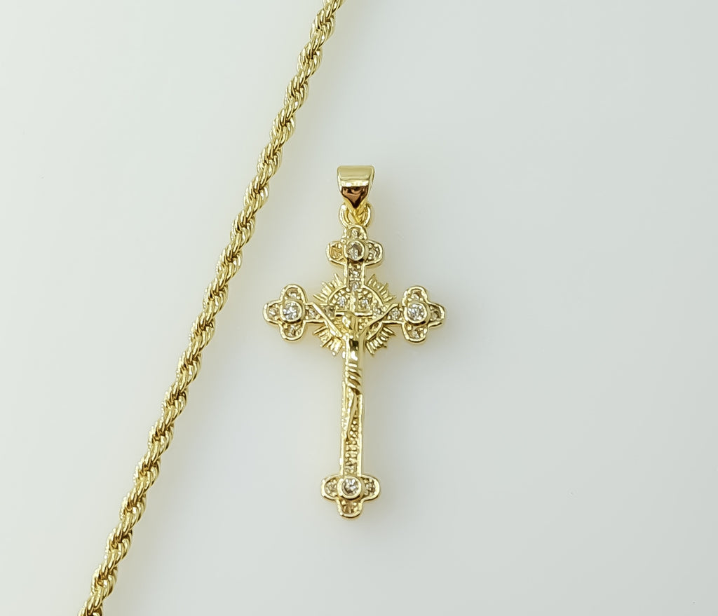 Gold plated small cross pendant on a braided chain necklace.

Gold plated small cross pendant on a rope chain necklace.