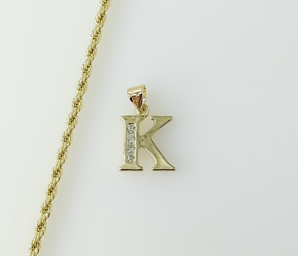 Gold plated rope and braided chain necklace with letter "K" pendant.

Gold plated dainty rope and braided chain necklace