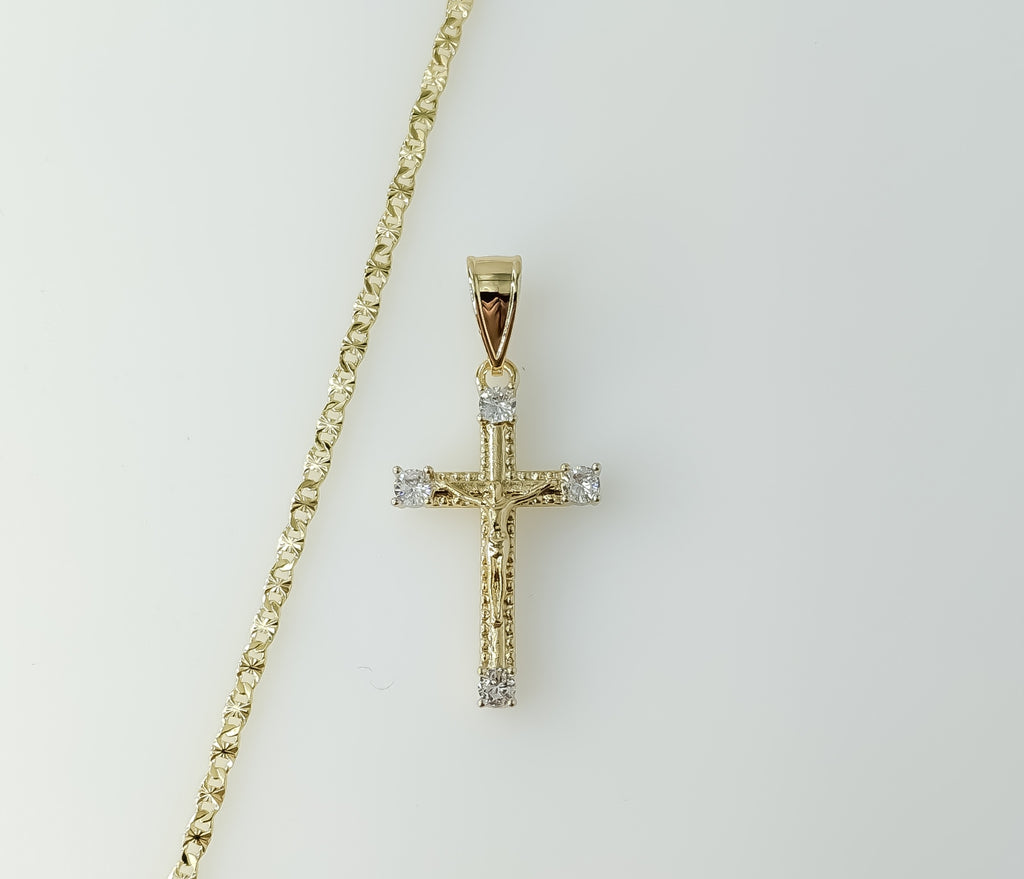 A delicate gold plated cross pendant on a small star chain necklace.