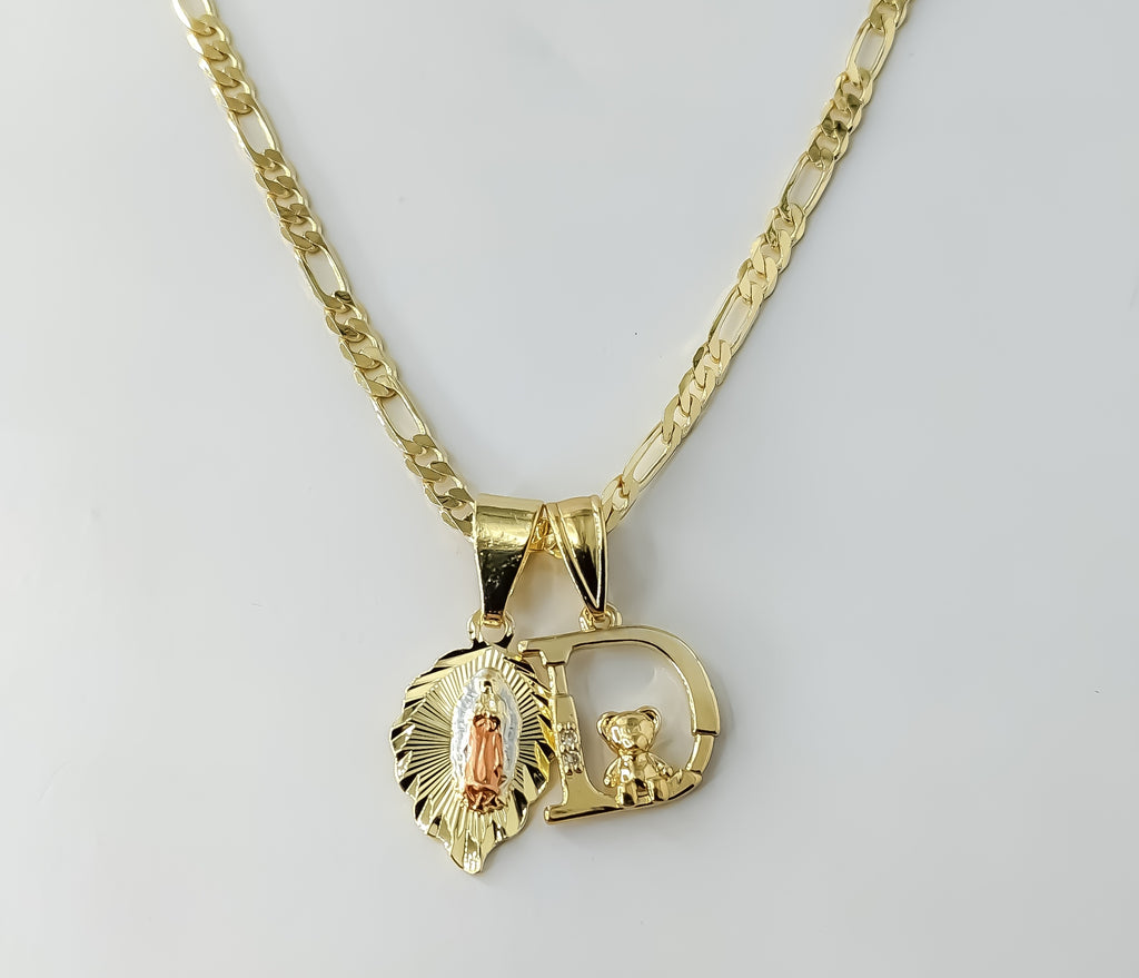 Gold plated Virgin Mary double pendants on a 3mm figaro chain necklace.
Small letter "D" charm in a dainty tri-color Vir