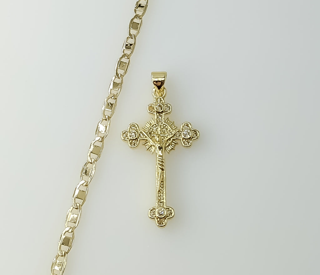 A gold plated mariner anchor chain necklace with a small cross pendant.

A gold plated chain necklace with a small cross