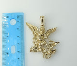 Large gold plated Archangel Saint Michael figurine pendant. 
Archangel Saint Michael figurine pendant in a circular shap