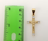 A small golden plated cross pendant with intricate details.
A delicate 3D cross pendant featuring a small star symbol.
A