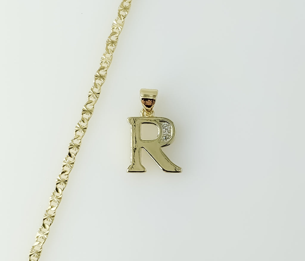 Gold plated star chain necklace with dainty letter "R" pendant attached.