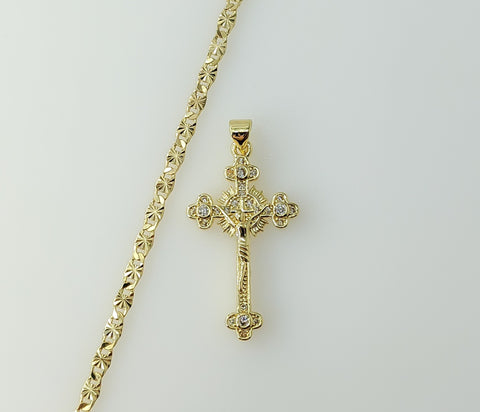 Gold plated small cross pendant on a delicate chain necklace.
Gold plated cross pendant suspended from a star chain neck