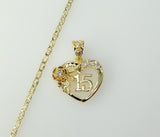 Gold plated heart pendant on a star-chain necklace with a quince charm.