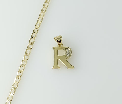 14k gold plated dainty Cuban chain necklace with a small letter R pendant.

14k gold plated Cuban link chain necklace fe