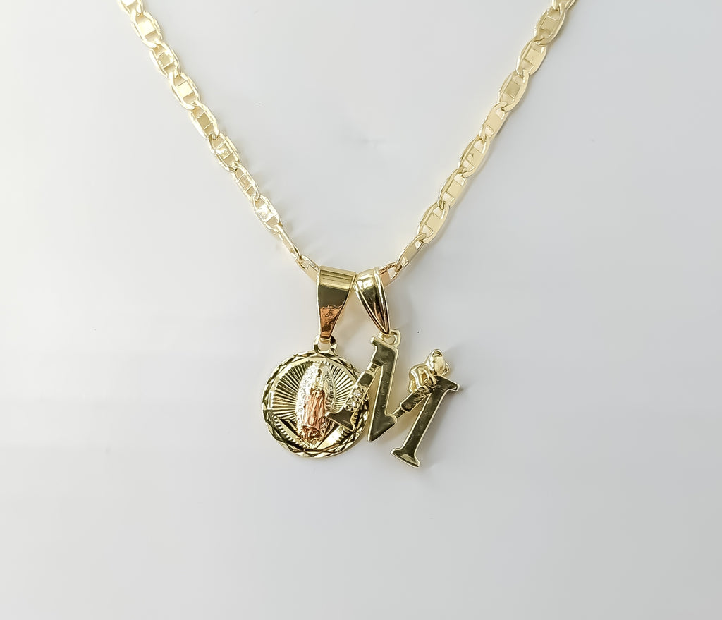 Gold plated Virgin Mary double pendants on 3mm mariner chain necklace.
Tri-color letter M and flat anchor pendant on del