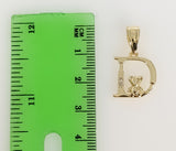 A small, intricately detailed Virgin Mary pendant in tri-color design.
A delicate, ornate Virgin Mary pendant in a trico