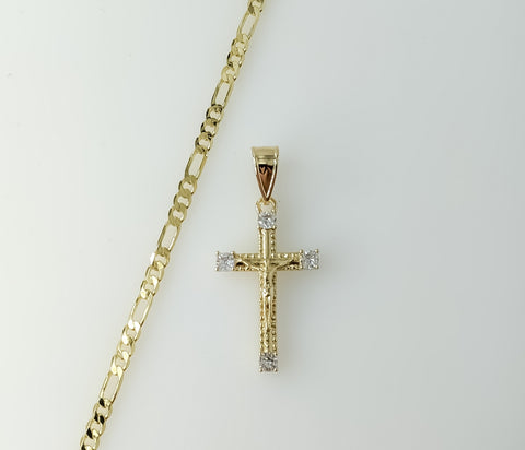 Gold plated Figaro chain necklace with small cross pendant and delicate design.