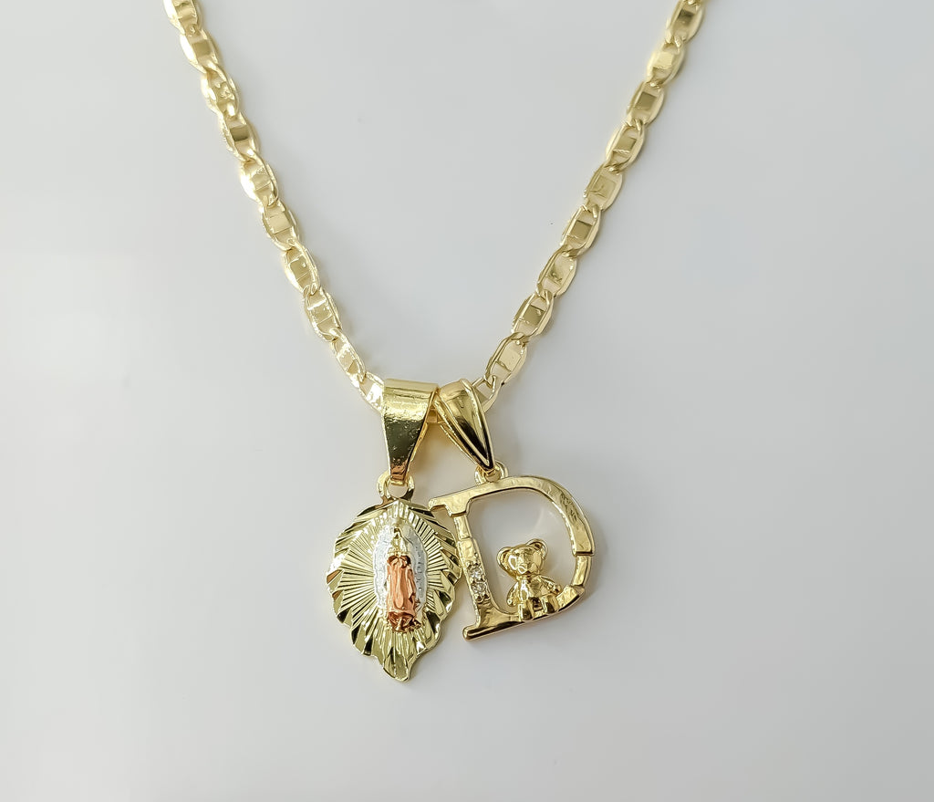A gold plated chain necklace with Virgin Mary pendants and anchor charms.

A dainty chain necklace featuring Virgin Mary