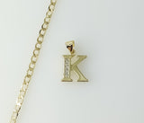 A 14K gold plated Cuban chain necklace with a dainty letter "K" pendant.

A 14K gold plated necklace with a delicate Cub