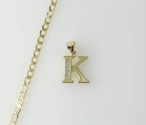 A 14K gold plated Cuban chain necklace with a dainty letter "K" pendant.

A 14K gold plated necklace with a delicate Cub