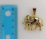 A gold plated elephant pendant with intricate details.
A detailed close-up of a plated elephant charm.
A close-up view o