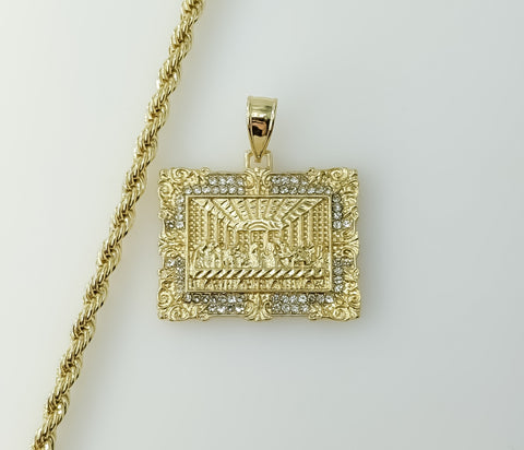 Gold plated rope and braided chain necklace with intricate design element.
