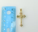 A small gold-plated cross pendant featuring a Jesus crucifix design.
A gold-plated cross pendant with intricate Jesus cr
