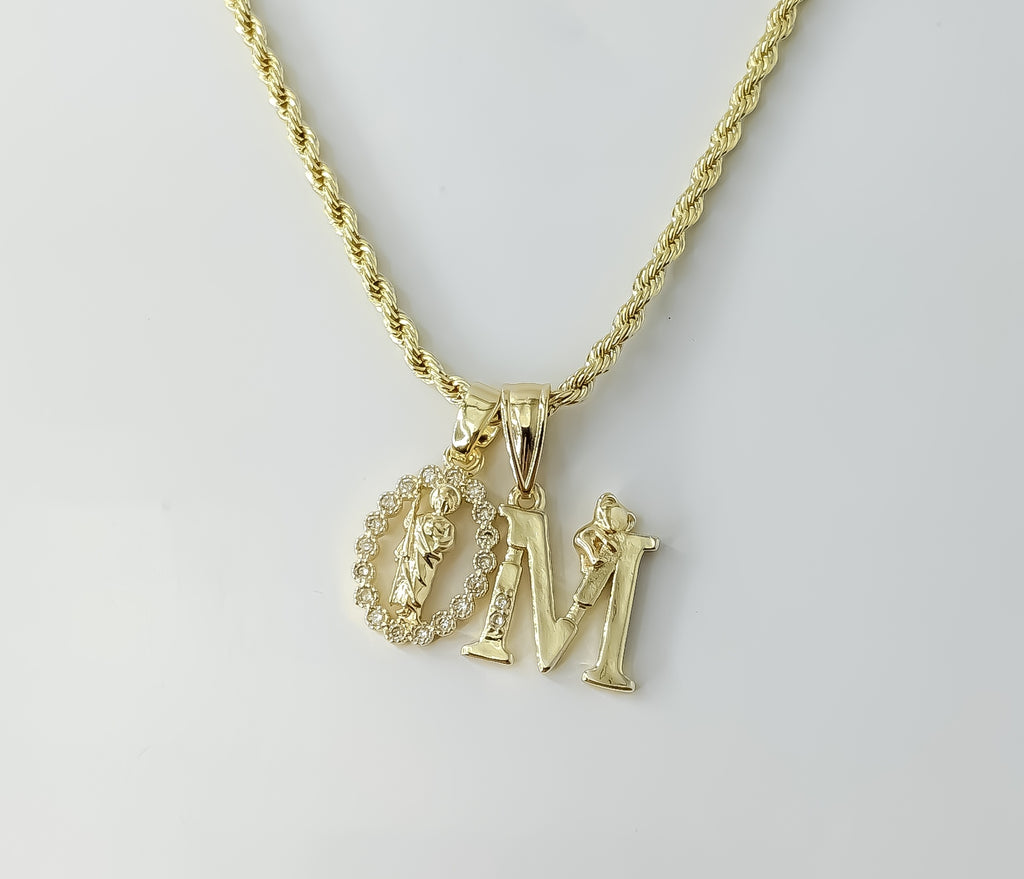 Gold plated double Saint Jude pendants on a braided chain necklace.
A dainty rope braided chain necklace with double Sai
