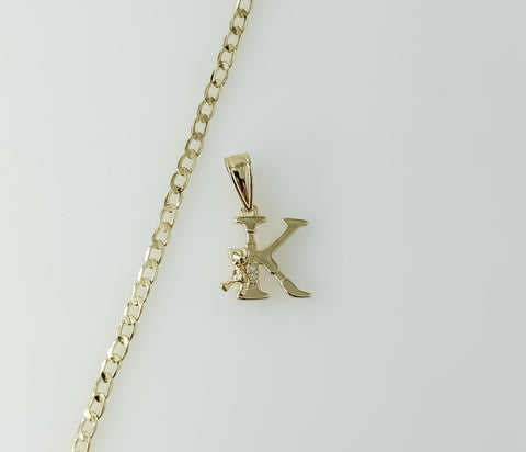 A delicate 14K gold plated Cuban chain necklace with a small letter K pendant.

A 14K gold plated dainty Cuban chain nec
