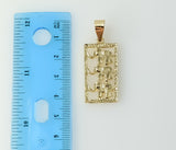 A gold-plated pendant featuring an elephant silhouette design 
An intricate elephant figurine pendant made of gold-plate